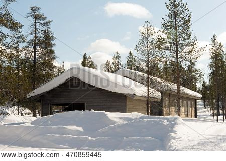 Wooden House In A Forest With Snow. Lapland, Finland