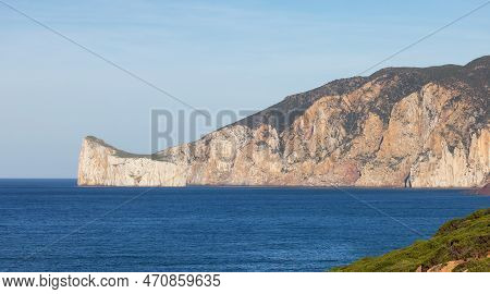 Rocky Cliffs On The Sea Coast. Sardinia, Italy. Nature Background
