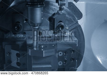 The 5-axis Cnc Milling Machine  Hole Cutting On The Metal  Part. The Hi-technology Injection Mold Pa