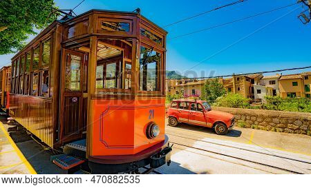 A Very Beautiful View Of A Tram. In The Bustling City Of The Modern Era, A Sleek Tram Glides Effortl