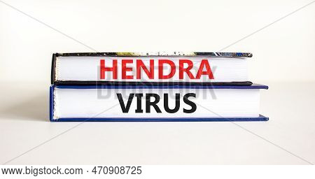 Hendra Virus Symbol. Concept Words Hendra Virus On Books. Beautiful White Table White Background. Me