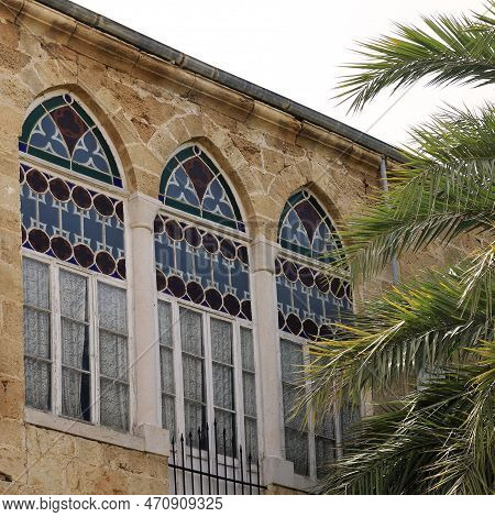 Lebanese Traditional Windows With Branches Of A Palm Tree.