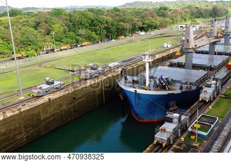 Two Cargo Ship Transiting The Miraflores Locks In The Panama Canal