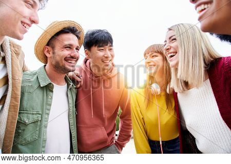 Portrait Of Group Of Multi-ethnic Friends Smiling And Looking At Each Other. College Vacation Trip.