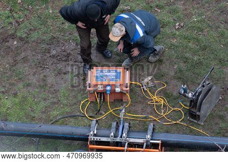 Tiraspol, Moldova - 13, February, 2023: Laying Sanitary Sewer Pipes. Preparation Of Plastic Pipes Fo