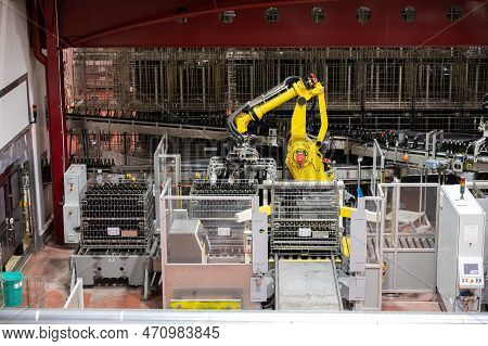 Production Of Cremant Sparkling Wine In Burgundy, France. Automatically Powered Bottling Lines On Fa