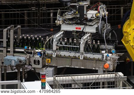 Production Of Cremant Sparkling Wine In Burgundy, France. Automatically Powered Bottling Lines On Fa
