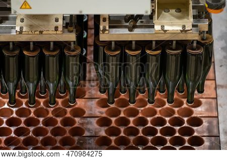 Production Of Cremant Sparkling Wine In Burgundy, France. Automatically Powered Bottling And Riddlin