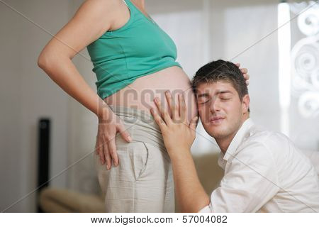 happy young cuple, pregnant woman