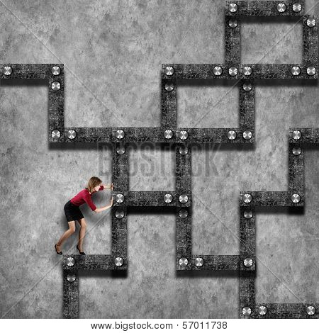 Labyrinth business concept with businesswoman seeking path