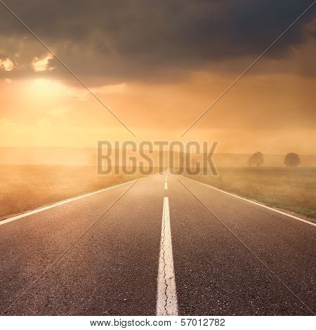 Driving On Asphalt Road At Sunset Towards The Sun Ii