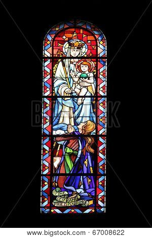 PARIS,FRANCE NOV 07: Madonna with Child, Notre-Dame de Clignancourt church located in the 18th arrondissement of Paris. Completed in 1863. Windows are from the Art Deco period. On Nov 07 in Paris