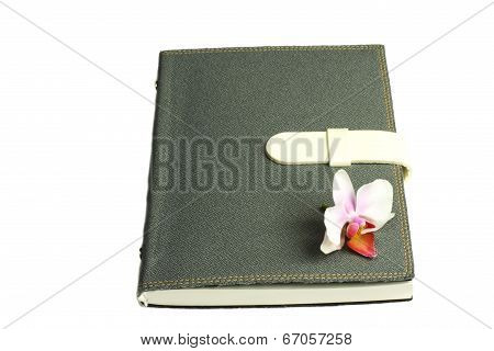 Notebook With Pen And Flower And Orchid