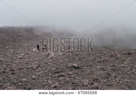 Indonesian Tourists In The Clouds On Volcano Merapi