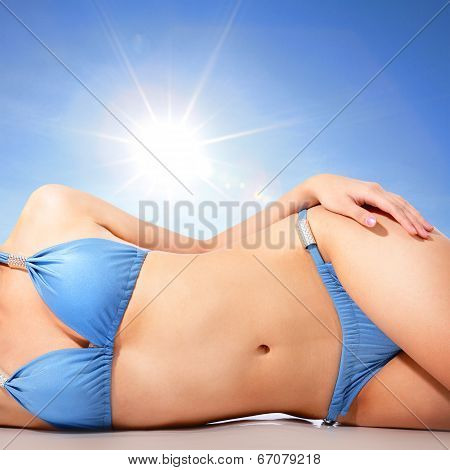 Young Woman Body At The Beach With Sun