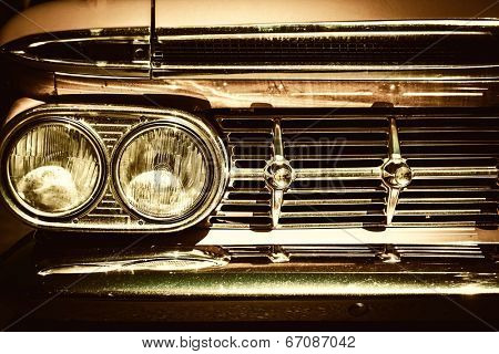 Close-up of retro car facia with chrome grille