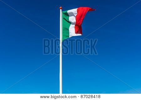 Italian Flag On The Blue Sky