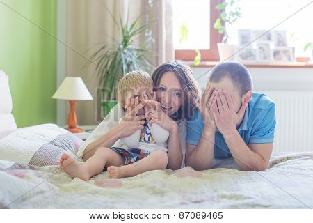 Young Attractive Parents and Child Portrait indoors