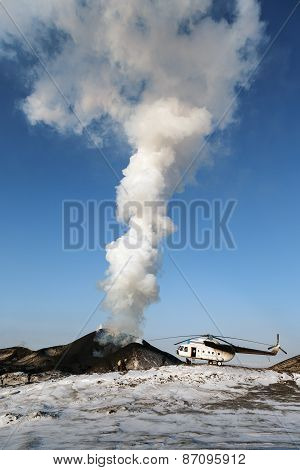 Eruption Tolbachik Volcano On Kamchatka, Helicopter And Tourists Near Smoking Volcano