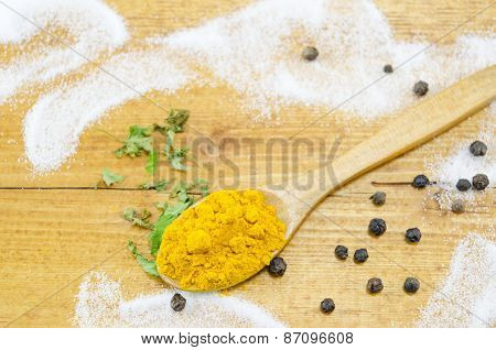 Curry In A Wooden Spoon On A Table