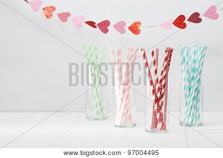 Colorful Paper Straws With A Garland Of Hearts