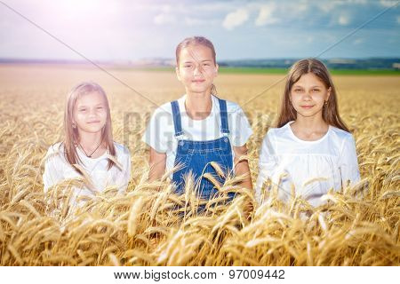 Happy girls meadow weat field