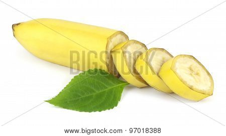 Sliced fresh banana with green leaf on white background