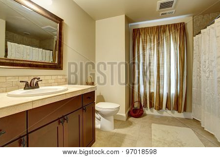 Elegant Bathroom With Tan Enterior.