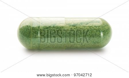 Single herbal capsule isolated on white