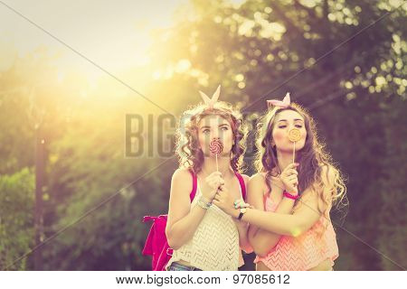 Best Girlfriends Are Hiding Lips Behind Lollipops. Sunset.