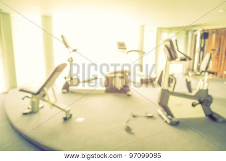 Abstract blur Fitness center with traineger equipments  ( Filtered image processed vintage effect. )