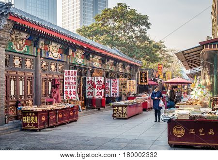 Tianjin, China - Nov 1, 2016: Tianjin Ancient Cultural Street; a shop preserved in the classical Qing Dynasty architectural style. Morning scene to what is a very popular tourist area.