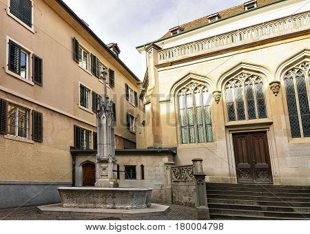 Fountain At Helferei On Zwingliplatz Square In Zurich Old Town