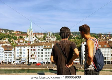Two Young Man Looking At Limmatquai In Zurich