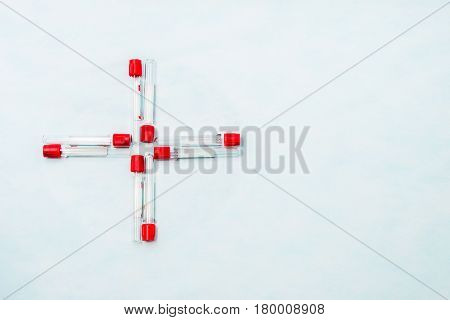 Test tubes for laboratory diagnosis blood tests on a blue background.