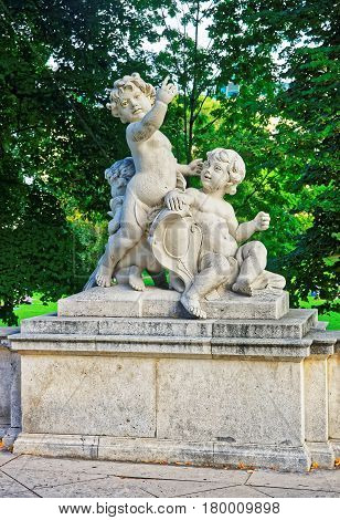 Angel Putti Statue In Burggarten Park In Vienna