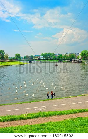 People At Embankment Of Visla River In Krakow