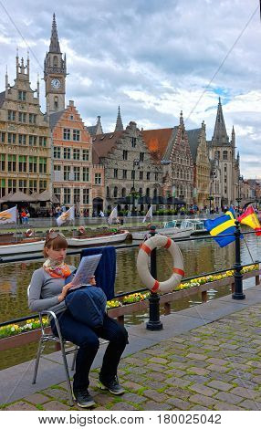 Girl At Embankment On Korenlei And Graslei Canal In Gent