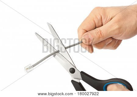 Hand with scissors and phone cable isolated on white background