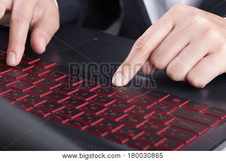 Finger Pushing Space Bar Button On Laptop Keyboard
