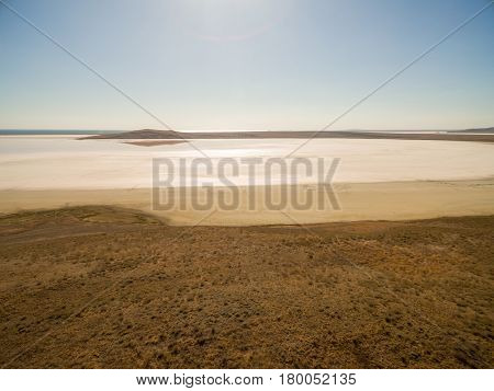 Aerial shot of Koyashskoe pink salt lake firth in Crimea
