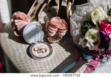 Wedding rings a bouquet of lavender and beige bridesmaid shoes