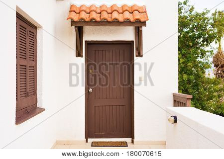 Wooden front door of a home. Front view.