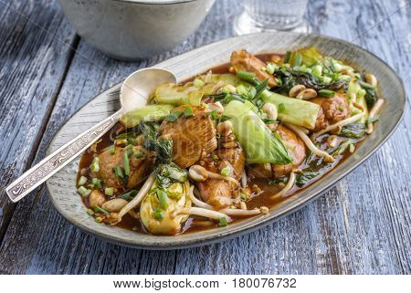 Traditional Chicken Gung Bao with Vegetable as close-up on a plate