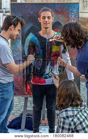 TIMISOARA ROMANIA - MARCH 31 2017: Face and body painting of a man. 3D art symbolizing on live at the street inside the CheckART Carnival organized by the City Hall Timisoara. Liberty Square.