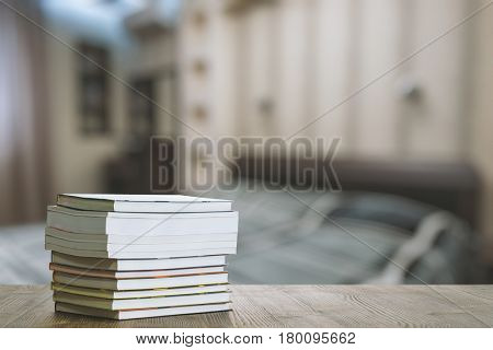 books on old wooden table in the bedroom