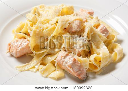 Pasta Fettuccine Alfredo With Chicken, Parmesan And Parsley On White Plate. Italian Cuisine.