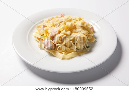 Pasta Fettuccine Alfredo With Chicken, Parmesan And Parsley On White Plate. Italian Cuisine.