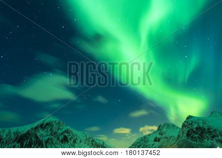 Aurora Borealis Known as Nother Lights Playing with Vivid Colors Over Lofoten Islands in Norway. Horizontal Image Orientation