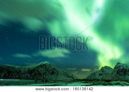 Aurora Borealis Known as Nother Lights Playing with Vivid Colors Over Lofoten Islands in Norway. Horizontal Image Orientation